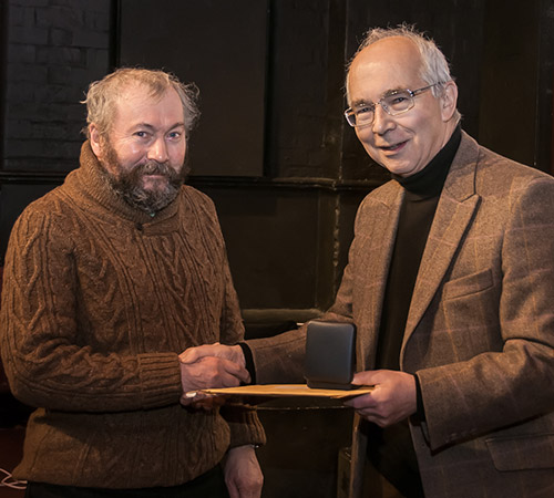 Ian receiving his medal from Richard Bifield. Photo by John Sweetland